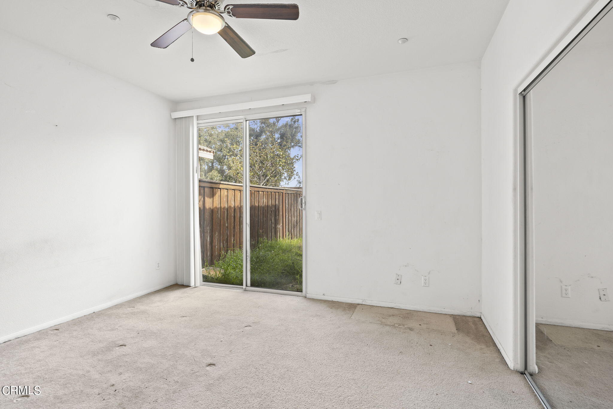 3870 Shakespeare Drive Oxnard, CA 93033 - Photo 13 of 29 an empty room with a window and a fan