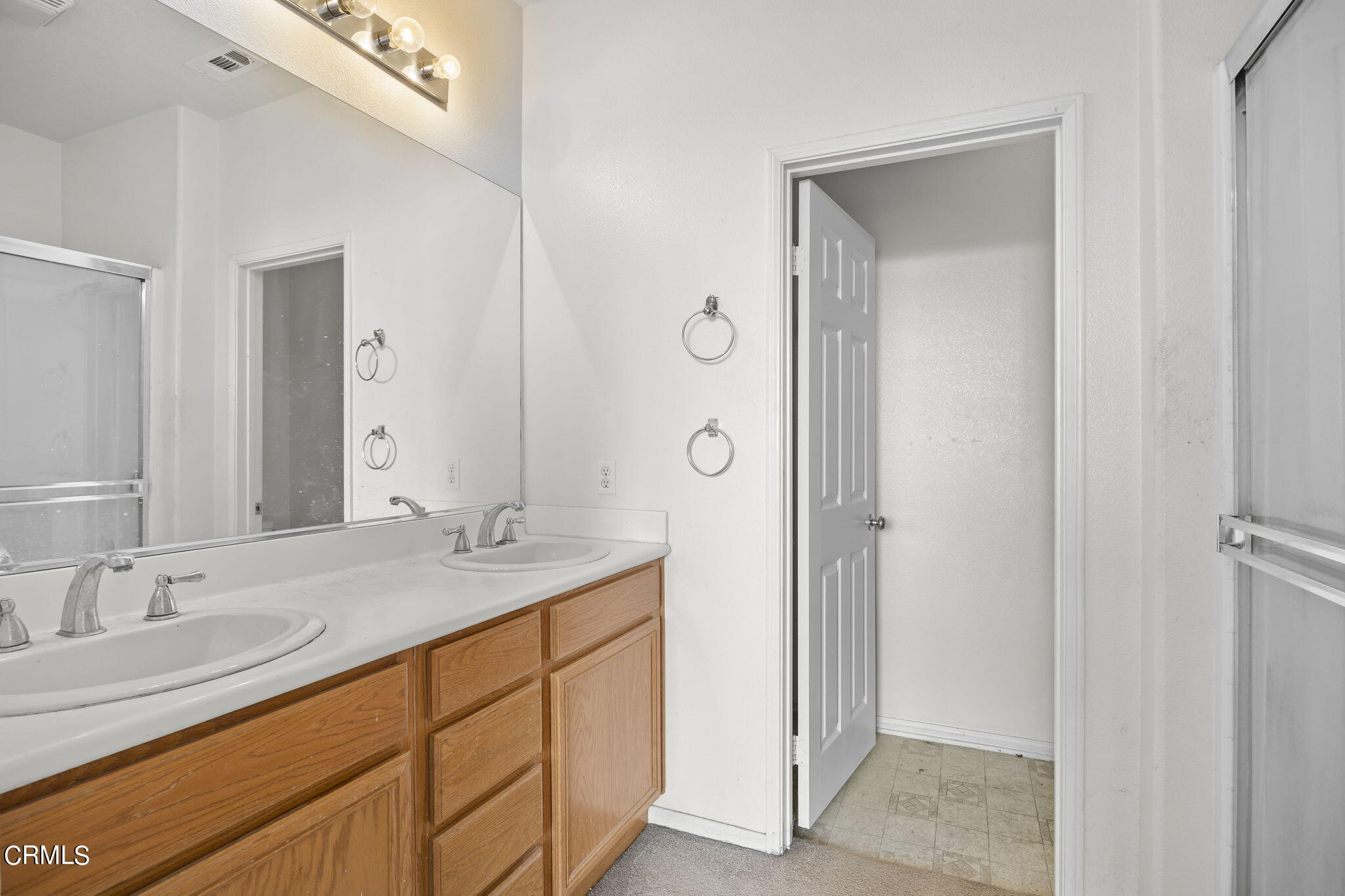 3870 Shakespeare Drive Oxnard, CA 93033 - Photo 15 of 29 a bathroom with a granite countertop sink and a mirror
