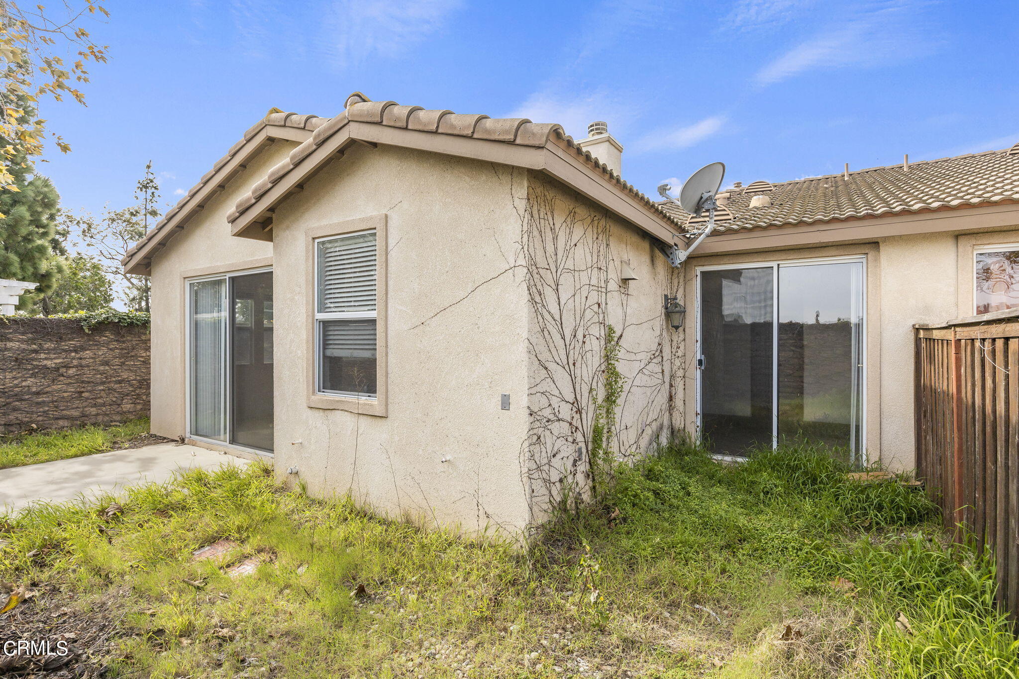 3870 Shakespeare Drive Oxnard, CA 93033 - Photo 21 of 29 a white house with a small yard and a large window