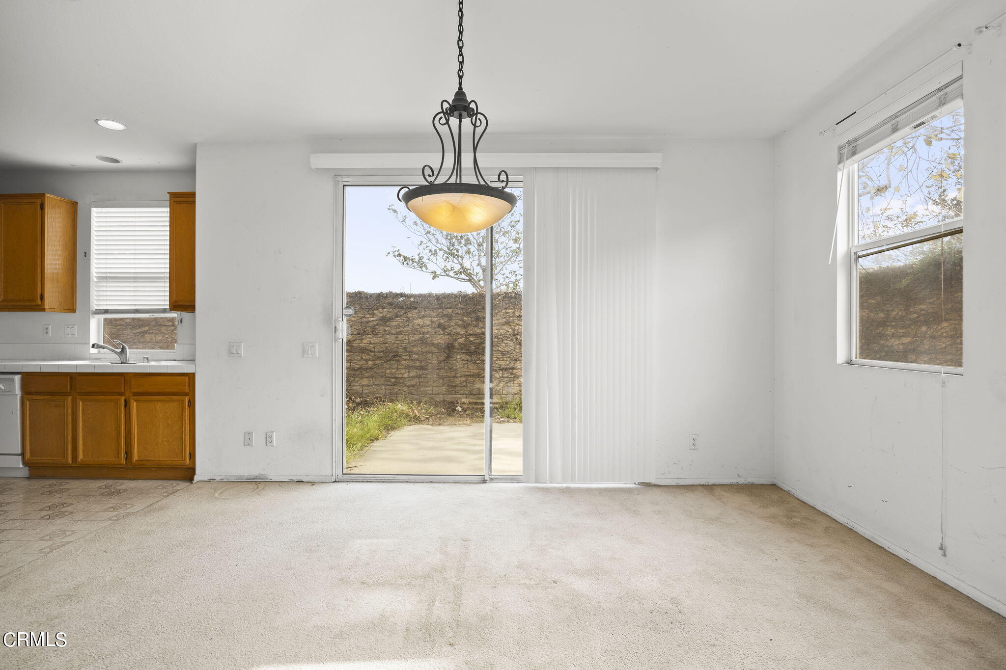 3870 Shakespeare Drive Oxnard, CA 93033 - Photo 7 of 29 a view of a kitchen with a sink and a fireplace