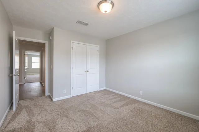 a bathroom with a sink vanity mirror and toilet