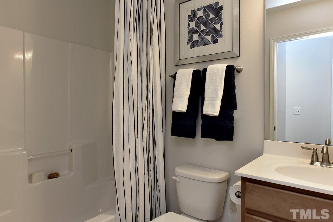 2567 Rambling Creek Road, Unit HOMESITE 14 Apex, NC 27523 - Photo 18 of 19 Photo is of Decorated Model Home at Woodcreek.