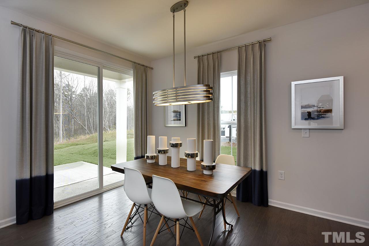 2567 Rambling Creek Road, Unit HOMESITE 14 Apex, NC 27523 - Photo 8 of 19 Photo is of Decorated Model Home at Woodcreek. .