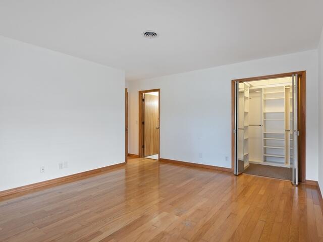 1705 Ashby Road Juno Beach, FL 33408 - Photo 12 of 21 a view of an empty room with wooden floor and a window