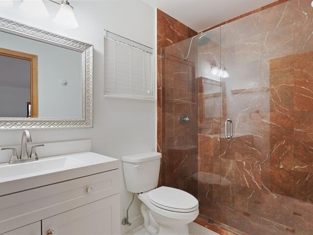1705 Ashby Road Juno Beach, FL 33408 - Photo 13 of 21 a bathroom with a sink a toilet and shower
