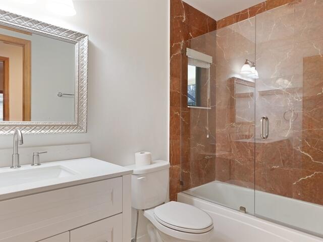 1705 Ashby Road Juno Beach, FL 33408 - Photo 15 of 21 a bathroom with a sink a toilet and shower
