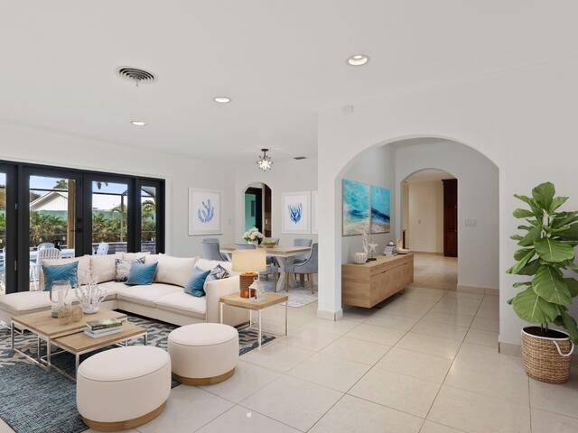 1705 Ashby Road Juno Beach, FL 33408 - Photo 3 of 21 a living room with furniture and a potted plant