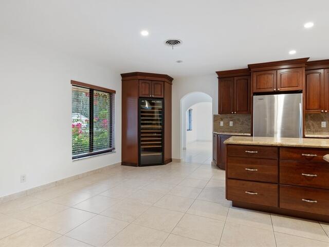 1705 Ashby Road Juno Beach, FL 33408 - Photo 8 of 21 a view of an empty room with a kitchen