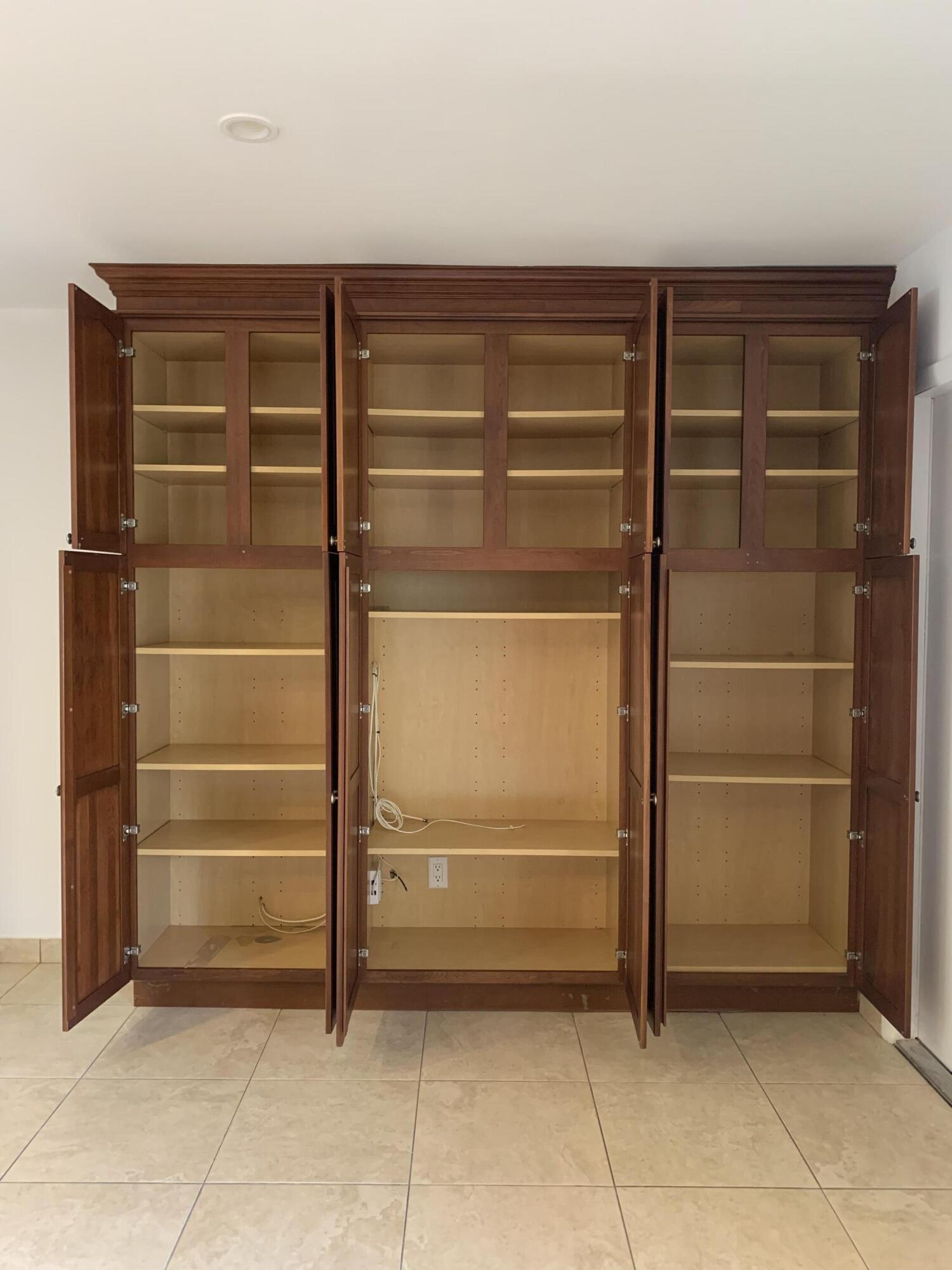 1705 Ashby Road Juno Beach, FL 33408 - Photo 9 of 21 a view of walk in closet with empty racks
