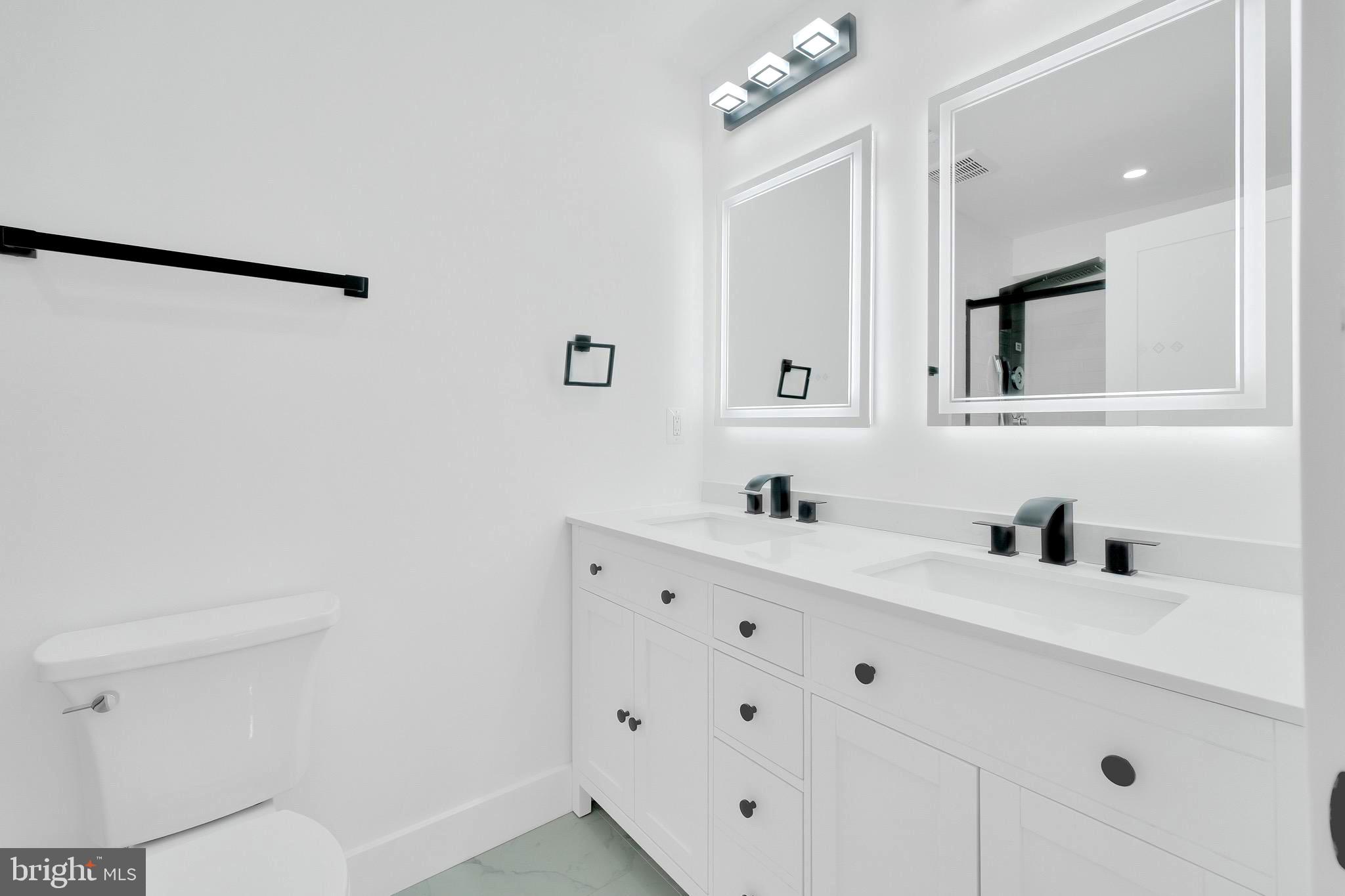 5318 5th Street Northwest Washington, DC 20011 - Photo 20 of 40 a bathroom with a sink and a mirror