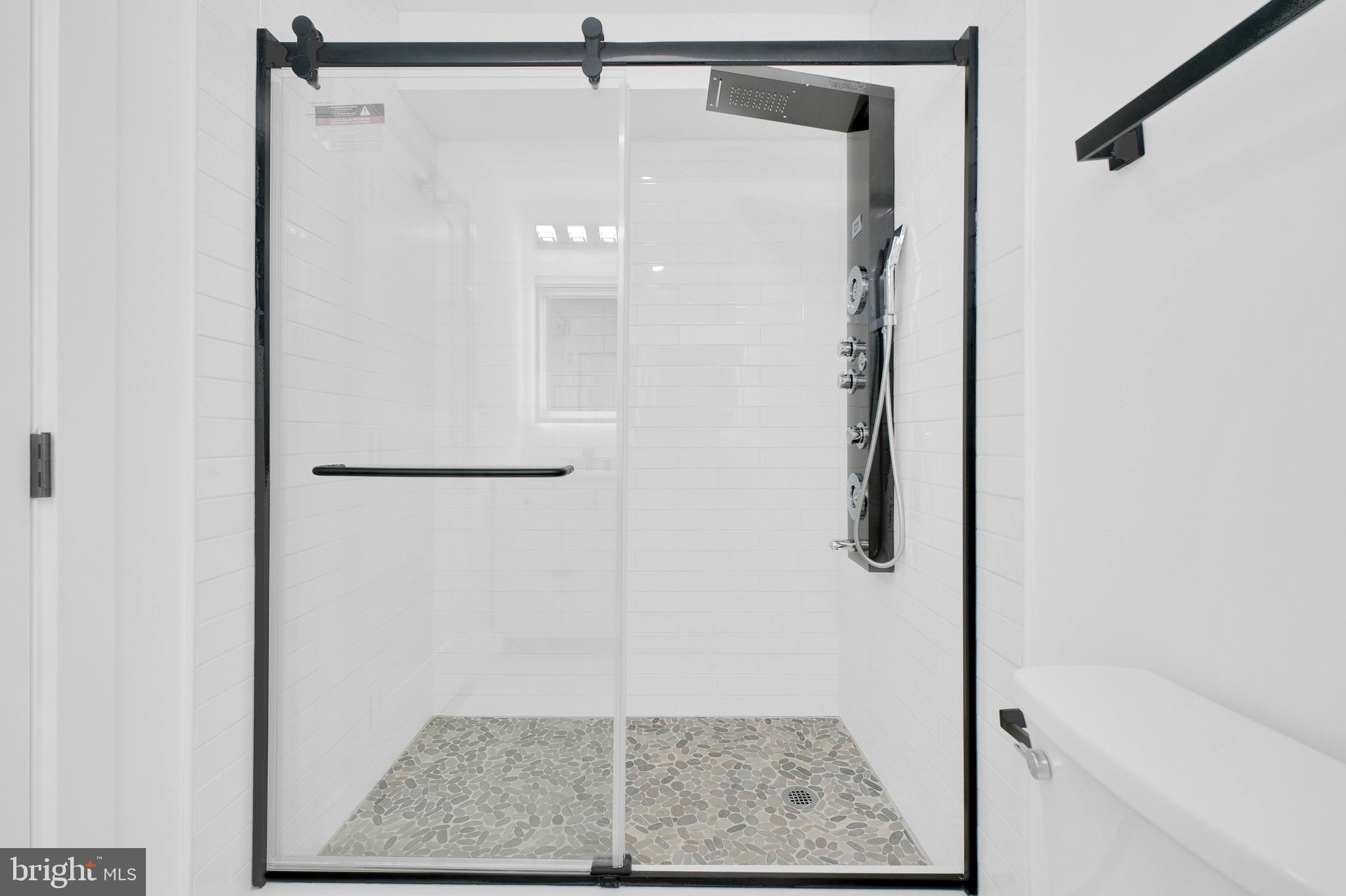 5318 5th Street Northwest Washington, DC 20011 - Photo 22 of 40 a bathroom with a glass shower door