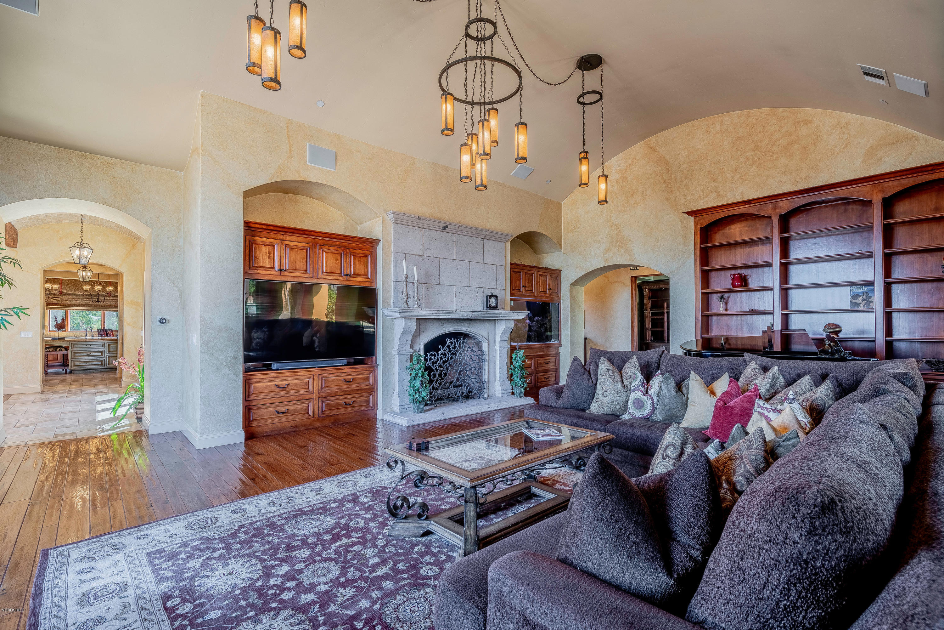 525 Rimrock Road Thousand Oaks, CA 91361 - Photo 12 of 95 a living room with furniture a fireplace and wooden floor