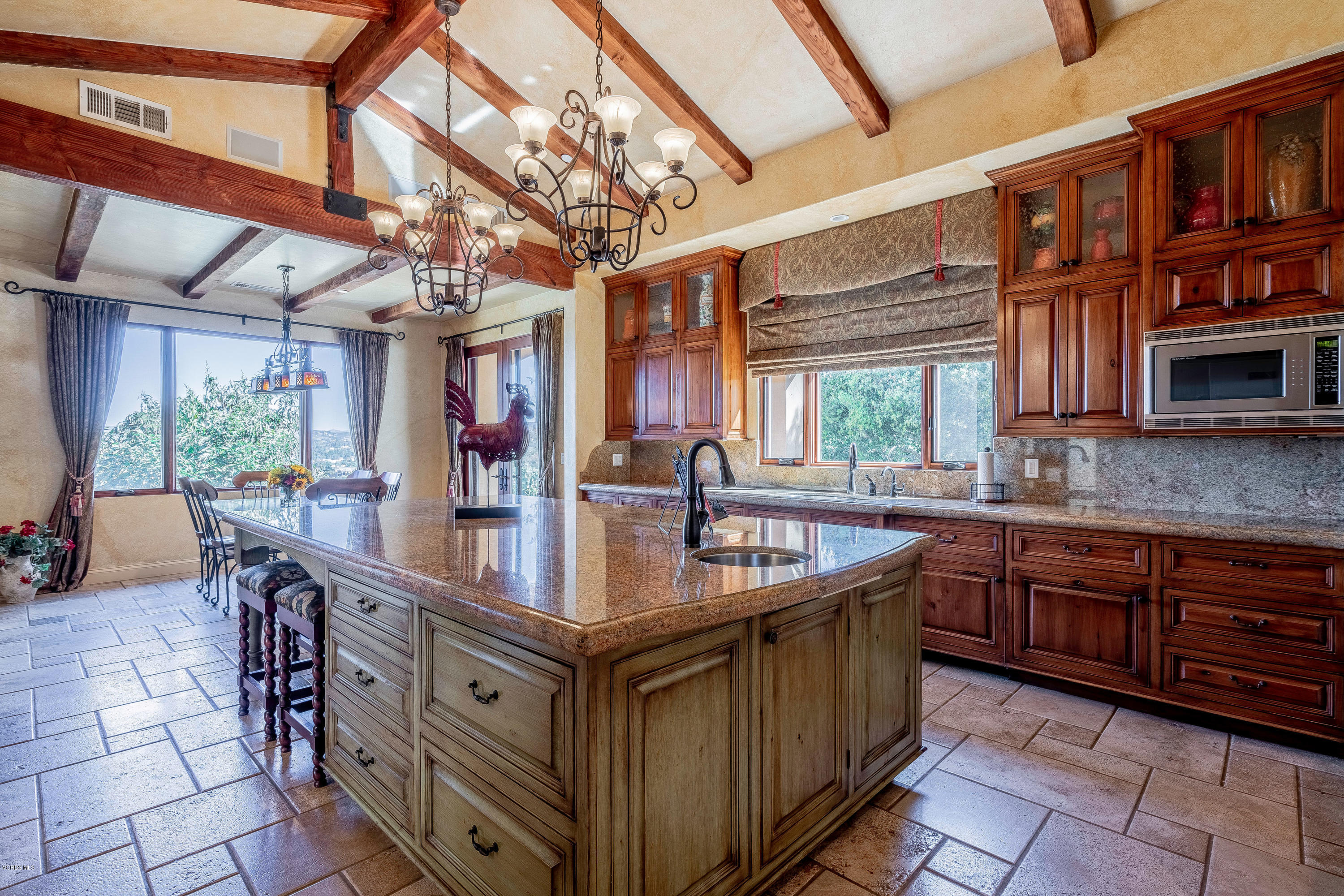 525 Rimrock Road Thousand Oaks, CA 91361 - Photo 19 of 95 a kitchen with stainless steel appliances granite countertop a sink and a wooden floors