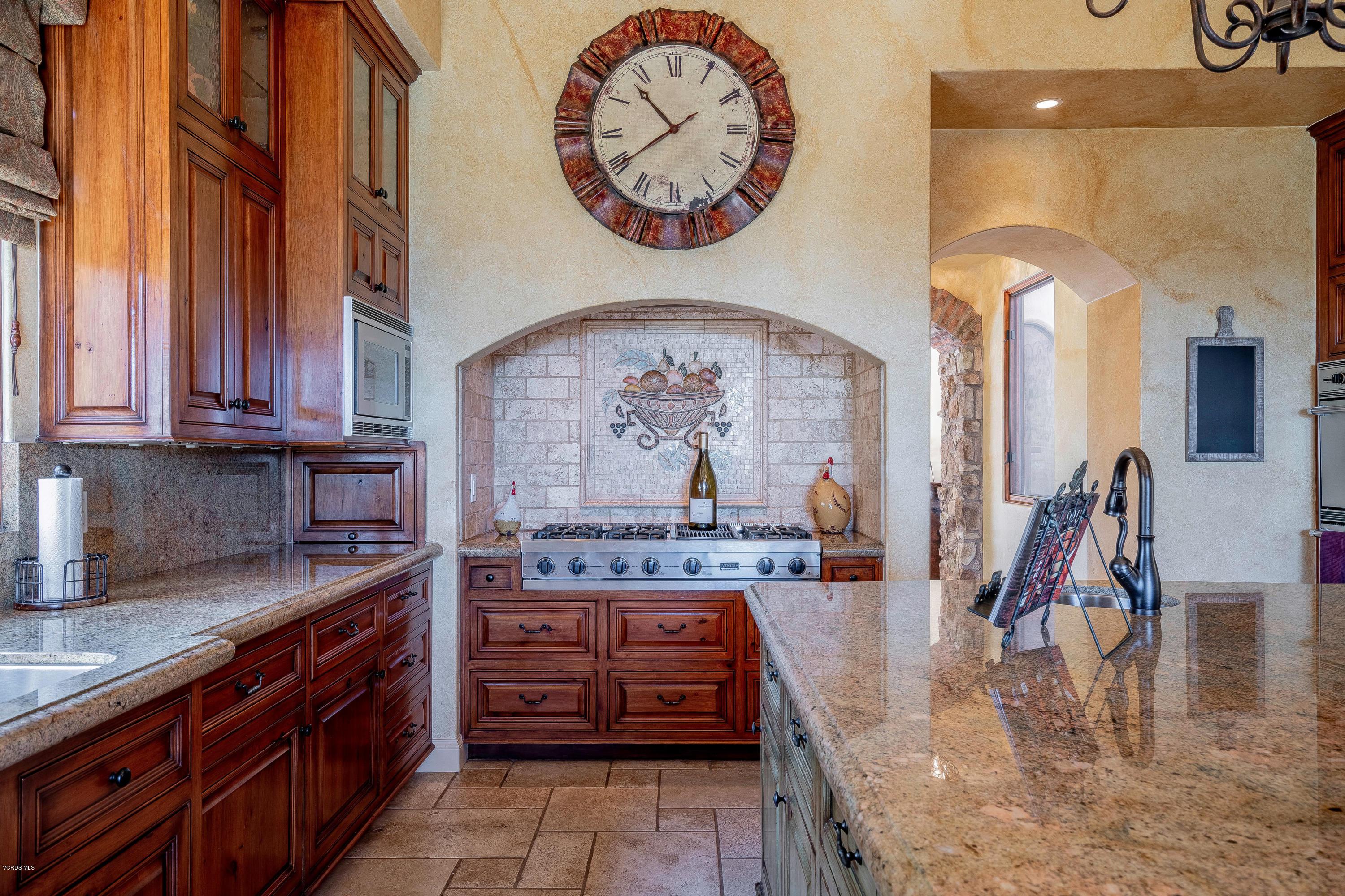 525 Rimrock Road Thousand Oaks, CA 91361 - Photo 21 of 95 a kitchen with stainless steel appliances granite countertop a stove and cabinets