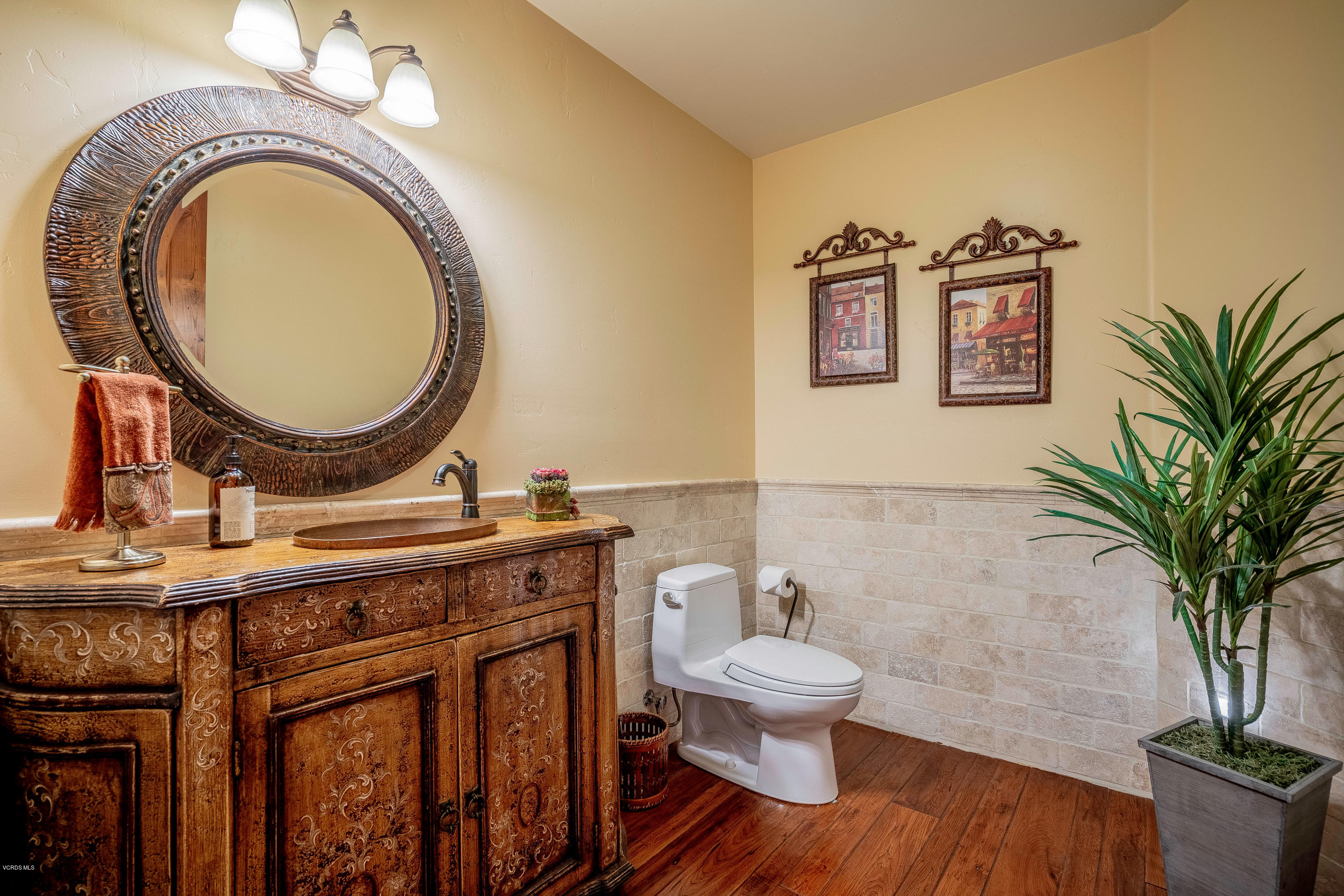 525 Rimrock Road Thousand Oaks, CA 91361 - Photo 28 of 95 a bathroom with a toilet a sink and mirror
