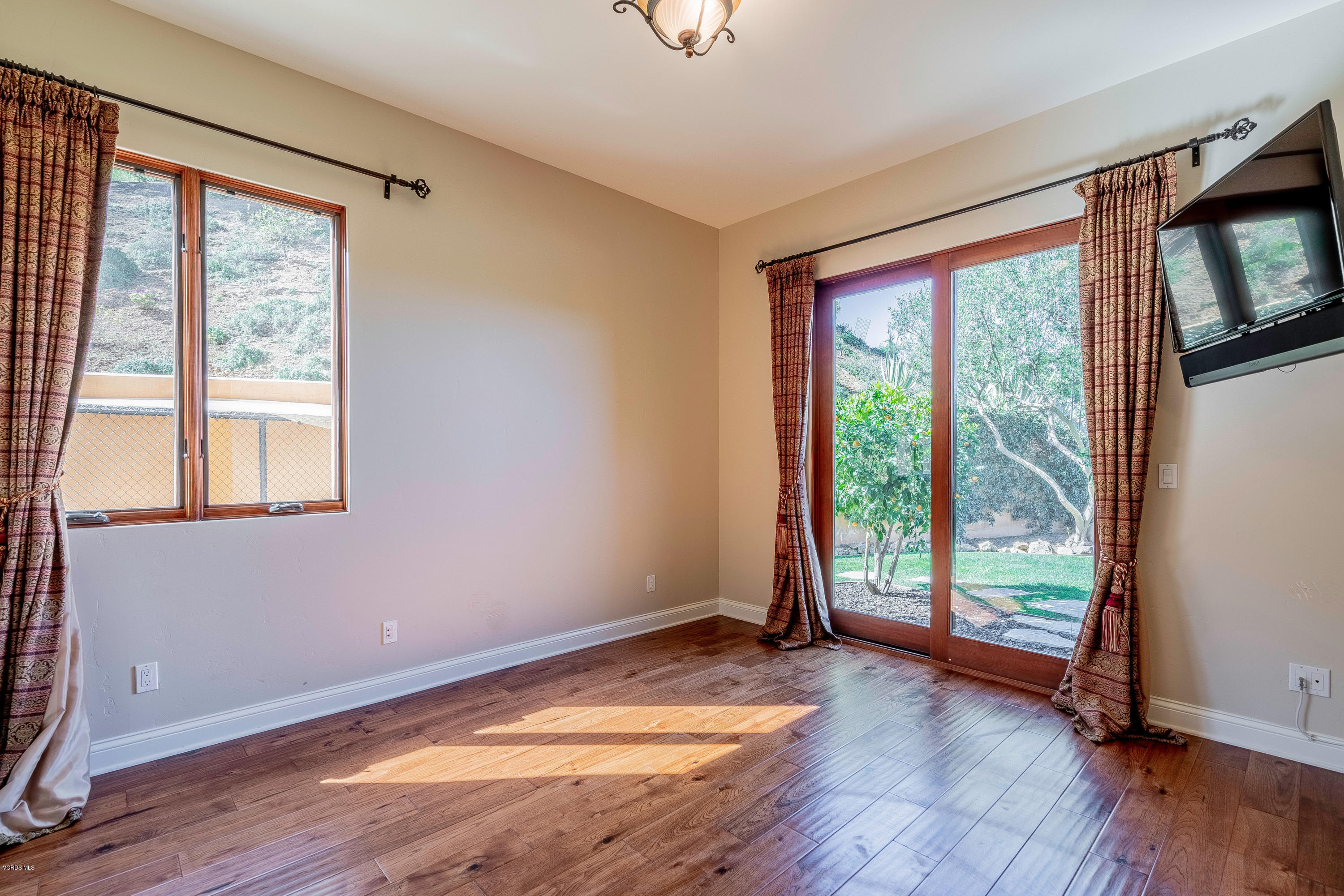525 Rimrock Road Thousand Oaks, CA 91361 - Photo 30 of 95 a view of empty room with wooden floor and fan