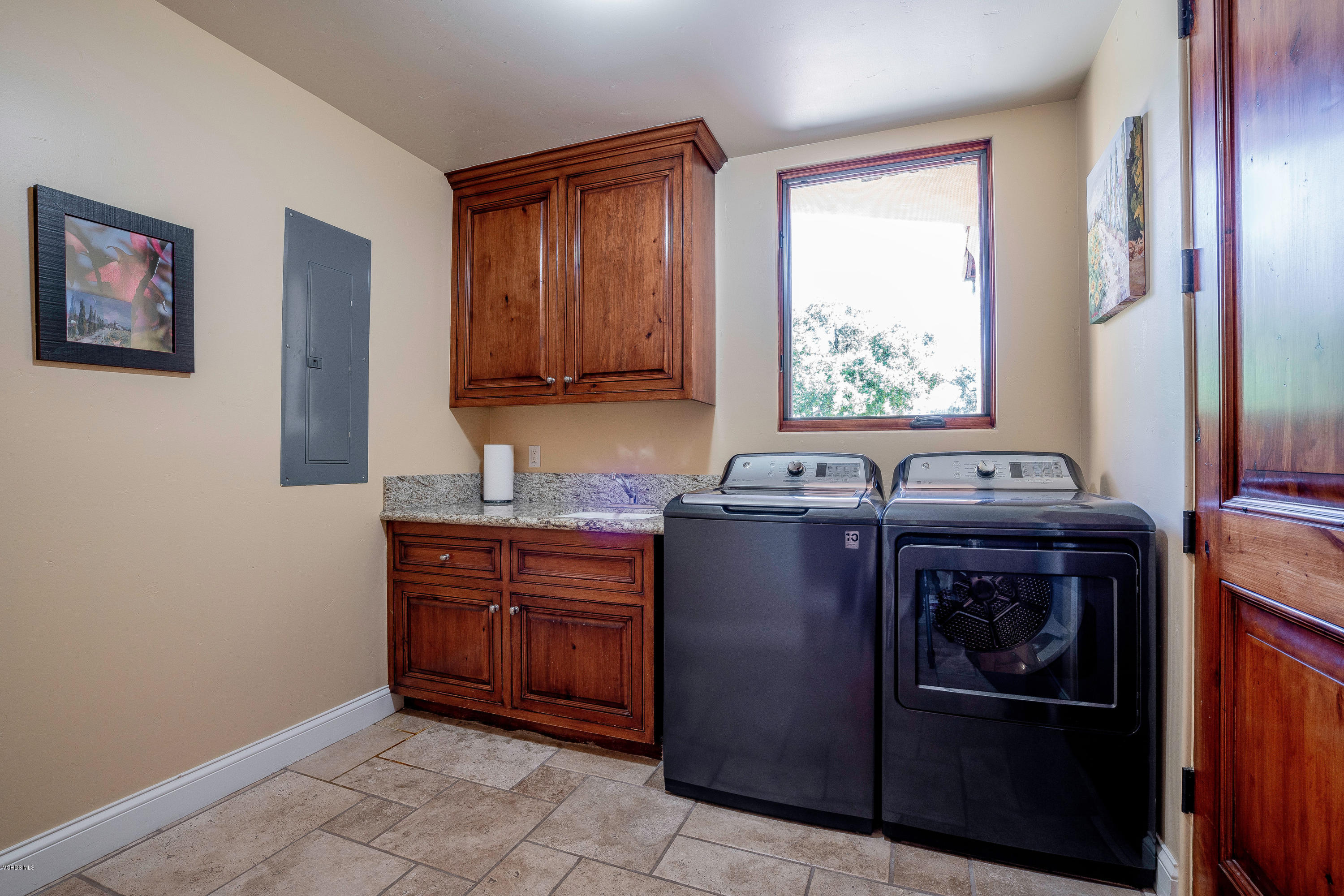 525 Rimrock Road Thousand Oaks, CA 91361 - Photo 32 of 95 a kitchen with stainless steel appliances granite countertop a sink stove and refrigerator