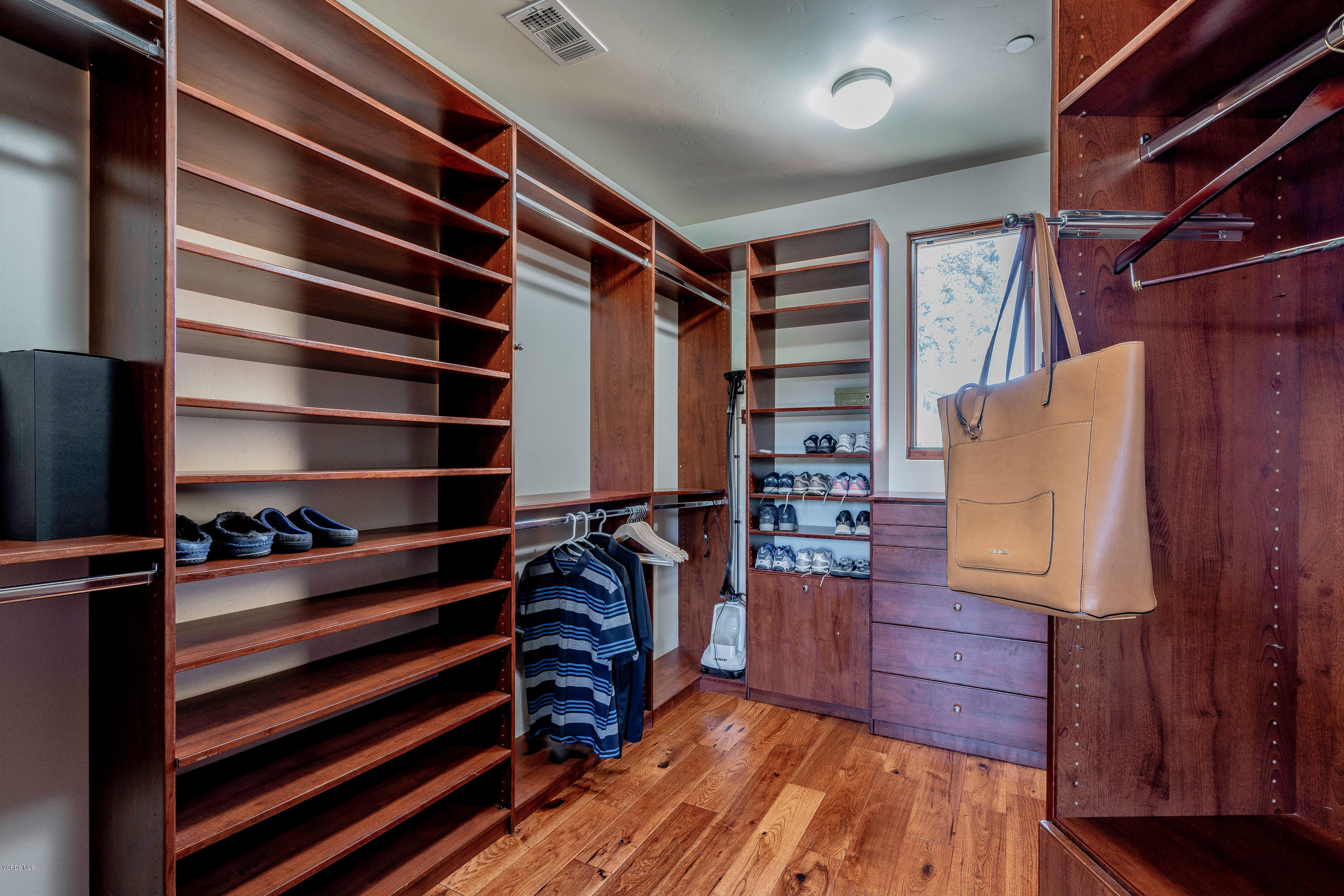 525 Rimrock Road Thousand Oaks, CA 91361 - Photo 36 of 95 a view of walk in closet with clothes and shoes