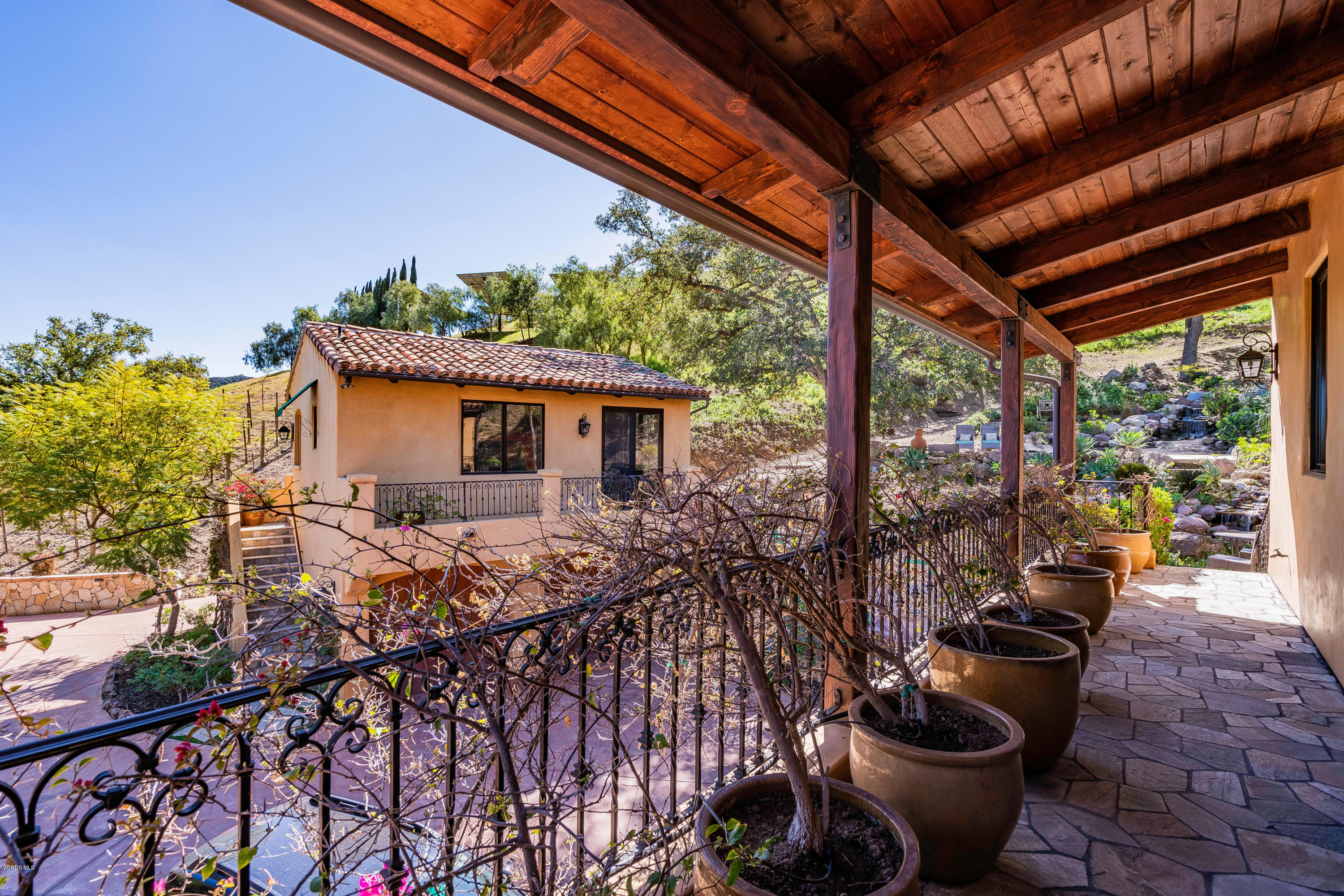 525 Rimrock Road Thousand Oaks, CA 91361 - Photo 40 of 95 a view of a patio with chairs and potted plants