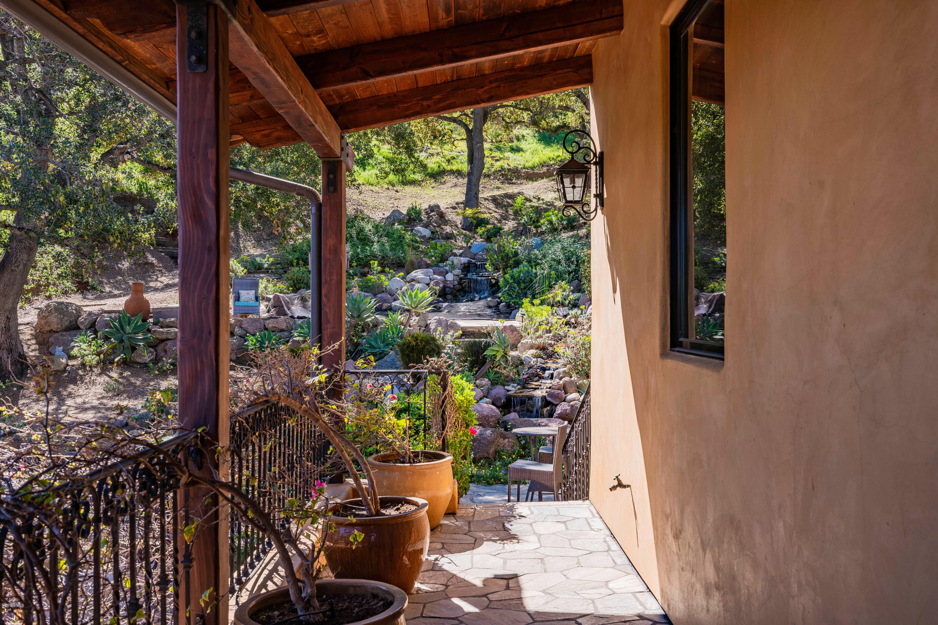 525 Rimrock Road Thousand Oaks, CA 91361 - Photo 41 of 95 a view of a porch with chairs and potted plants