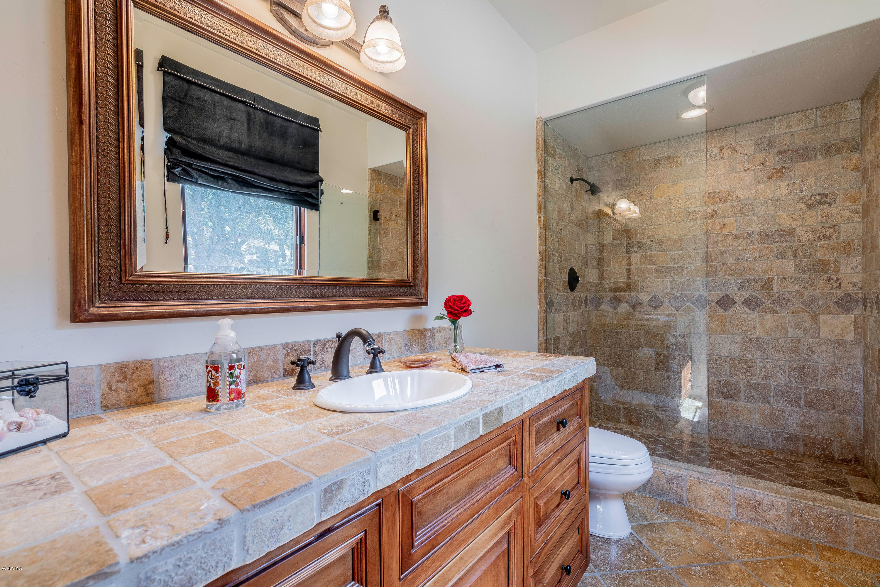 525 Rimrock Road Thousand Oaks, CA 91361 - Photo 43 of 95 a bathroom with a sink a toilet and shower