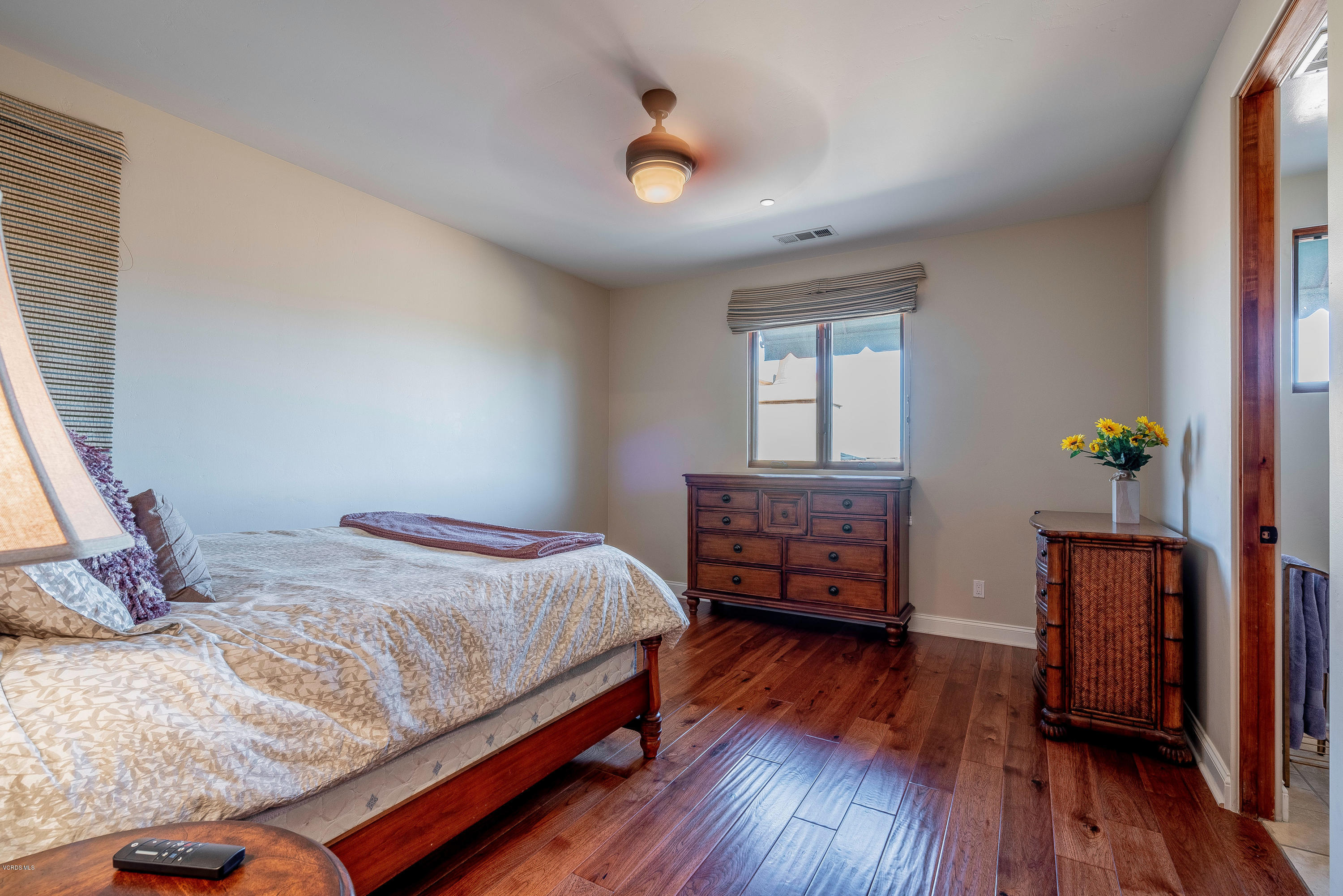 525 Rimrock Road Thousand Oaks, CA 91361 - Photo 44 of 95 a bedroom with a bed and wooden floor