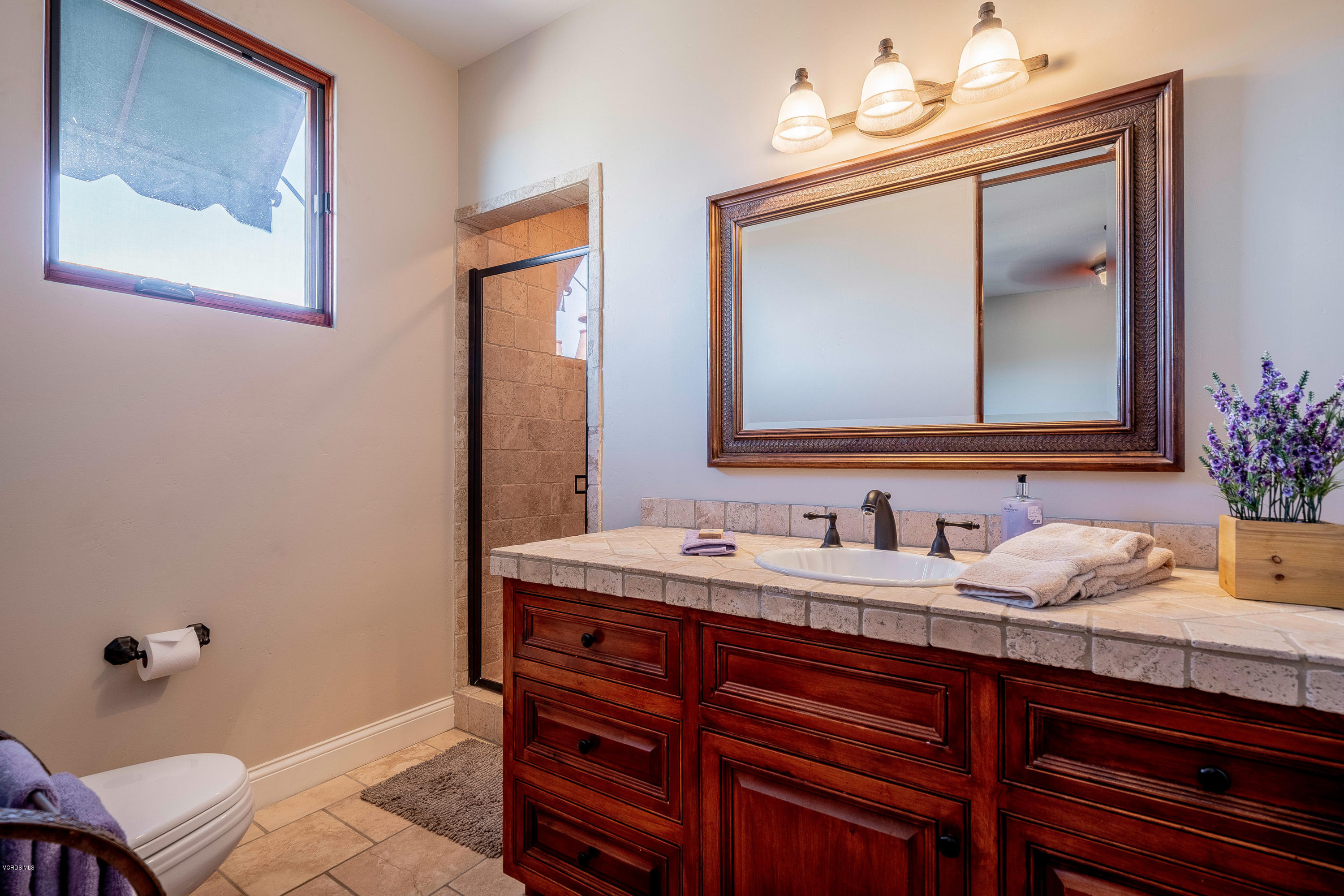 525 Rimrock Road Thousand Oaks, CA 91361 - Photo 45 of 95 a bathroom with a sink and a mirror