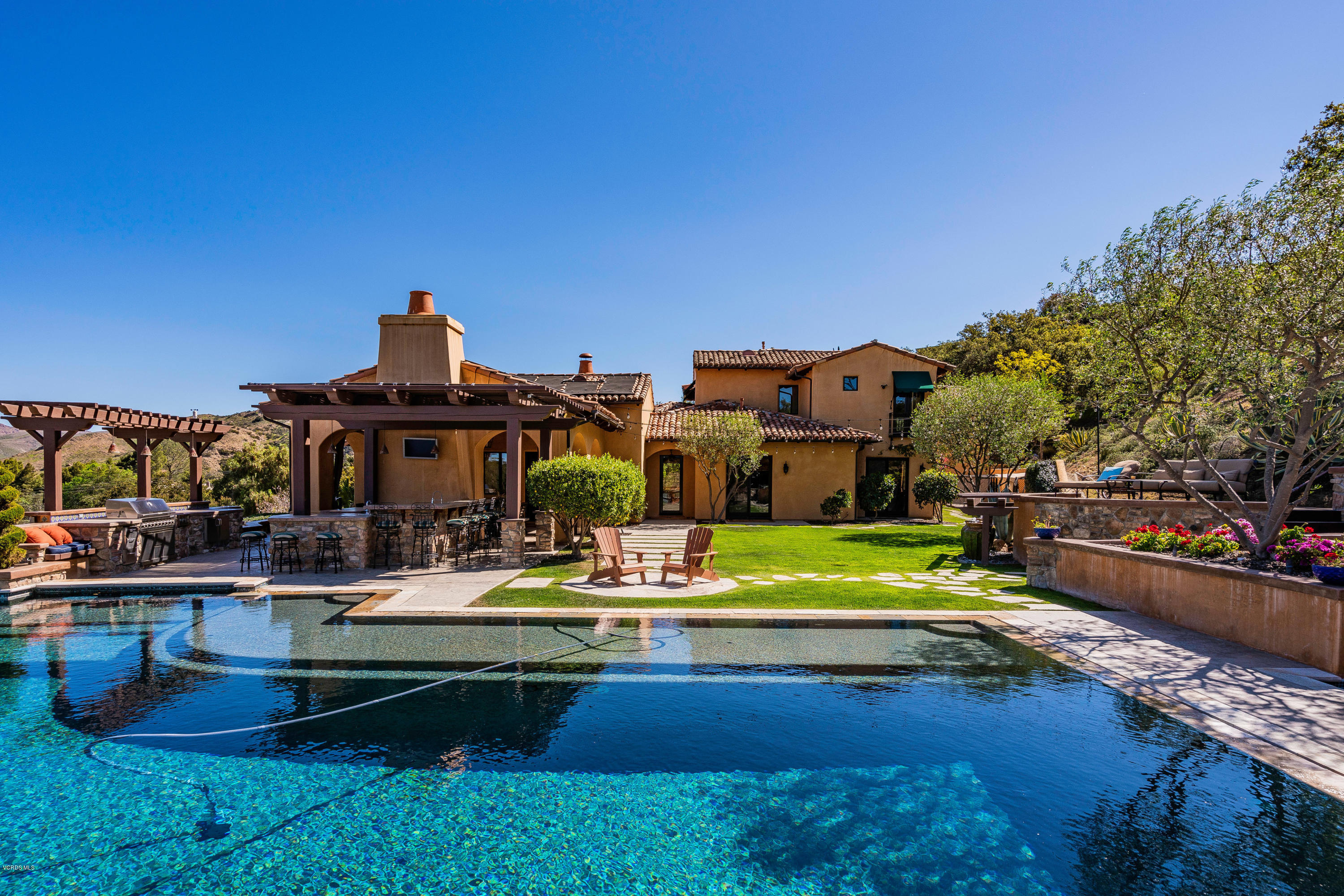 525 Rimrock Road Thousand Oaks, CA 91361 - Photo 52 of 95 a view of a house with swimming pool and sitting area