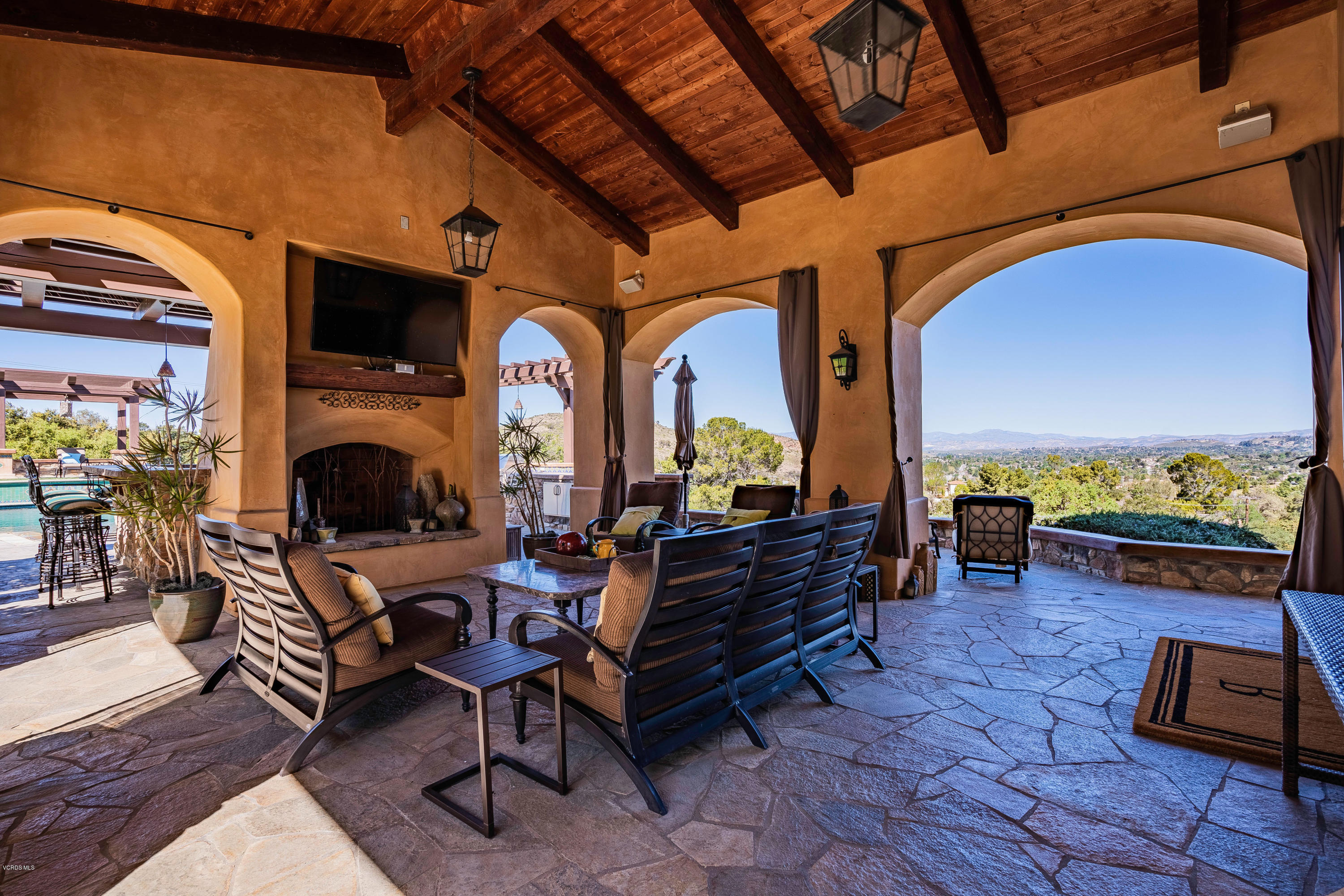 525 Rimrock Road Thousand Oaks, CA 91361 - Photo 58 of 95 a living room with furniture a flat screen tv and a fireplace