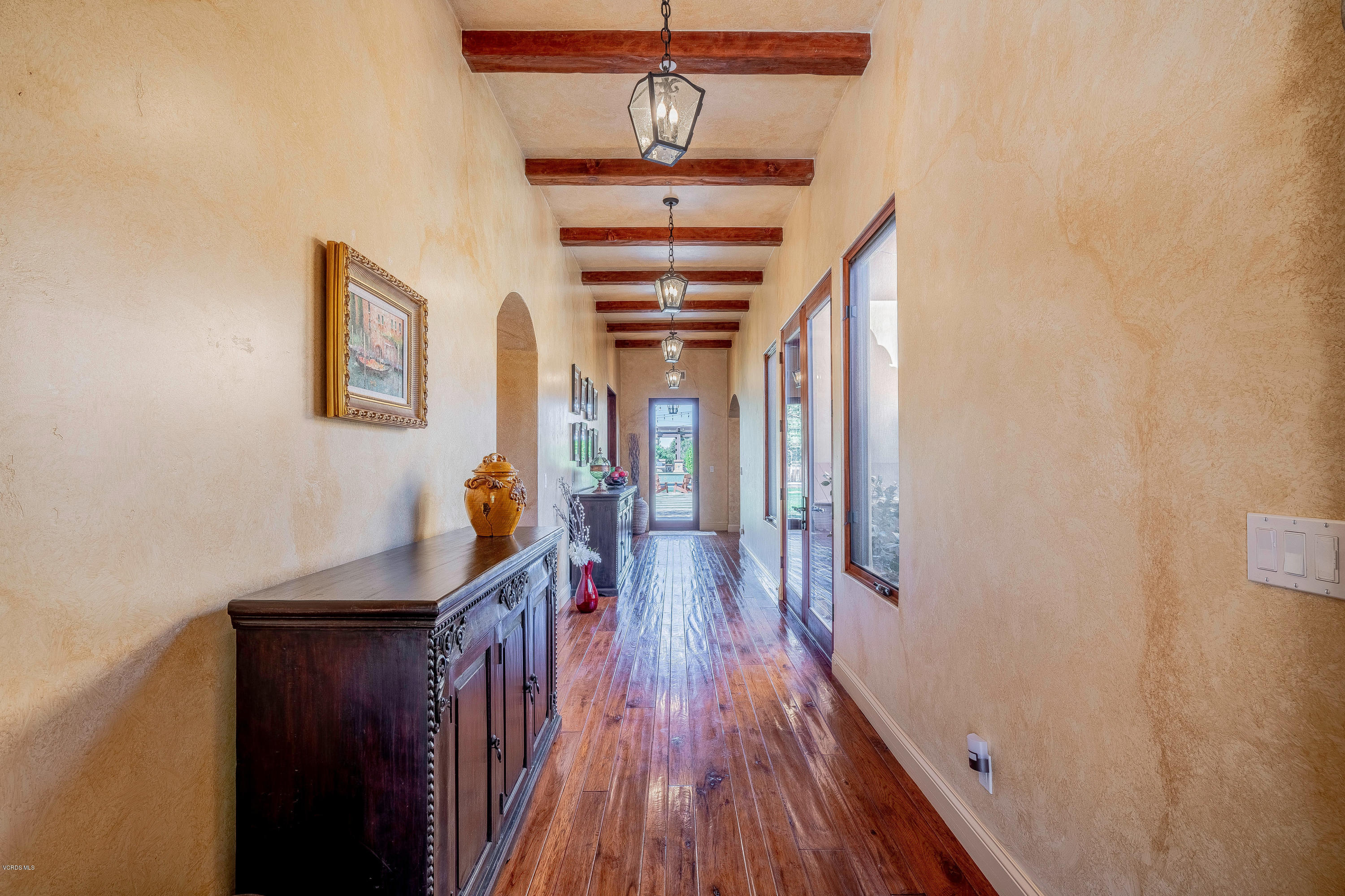 525 Rimrock Road Thousand Oaks, CA 91361 - Photo 7 of 95 a view of a hallway with wooden floor and staircase