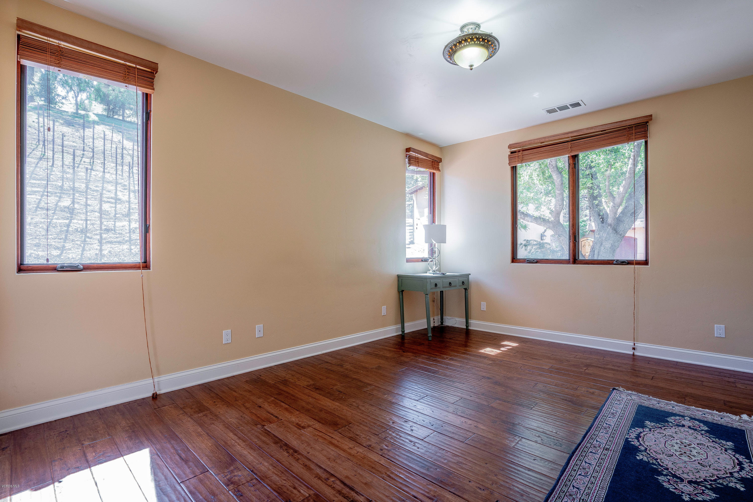525 Rimrock Road Thousand Oaks, CA 91361 - Photo 78 of 95 a view of an empty room with window and wooden floor