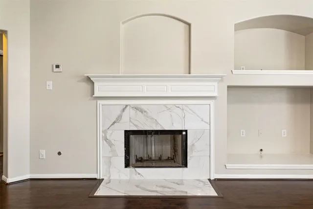 a white building with a fireplace