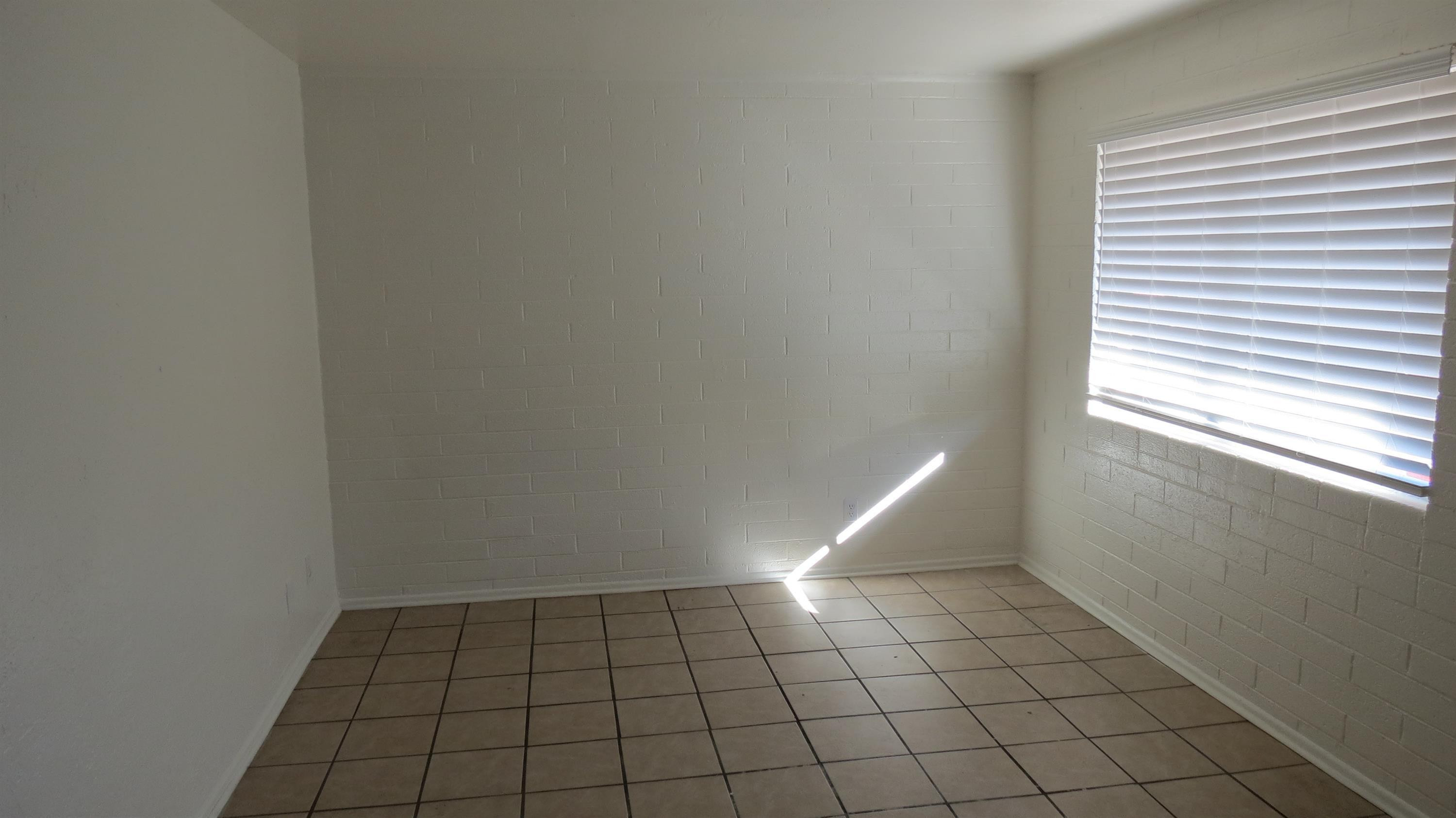 4329 North Longview Avenue, Unit 2 Phoenix, AZ 85014 - Photo 5 of 12 a view of an empty room and window