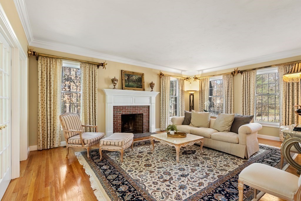 28 Cutler Farm Road Sudbury, MA 01776 - Photo 15 of 42 a living room with furniture and a fireplace