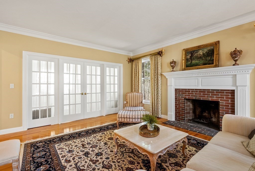 28 Cutler Farm Road Sudbury, MA 01776 - Photo 16 of 42 a living room with furniture and a fireplace
