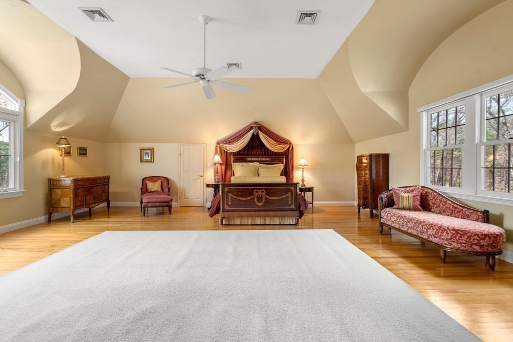 28 Cutler Farm Road Sudbury, MA 01776 - Photo 22 of 42 a spacious bedroom with a bed a couch and dresser