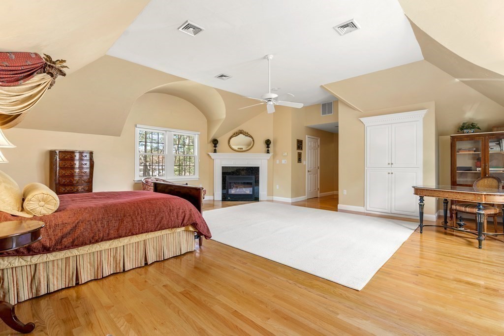 28 Cutler Farm Road Sudbury, MA 01776 - Photo 24 of 42 a spacious bedroom with a bed and dresser with wooden floor