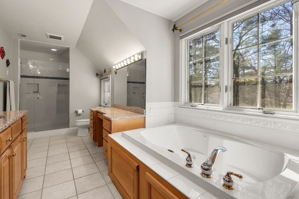 28 Cutler Farm Road Sudbury, MA 01776 - Photo 26 of 42 a bathroom with a tub sink and mirror