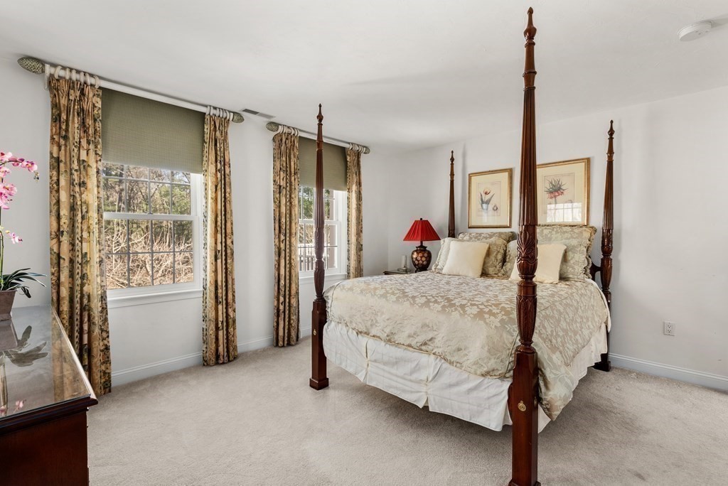 28 Cutler Farm Road Sudbury, MA 01776 - Photo 30 of 42 a bed room with a bed window and a mirror