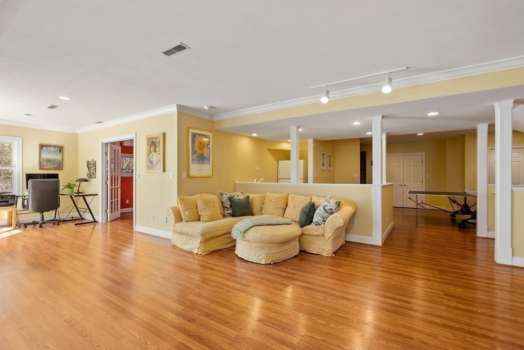 28 Cutler Farm Road Sudbury, MA 01776 - Photo 32 of 42 a living room with furniture and a wooden floor