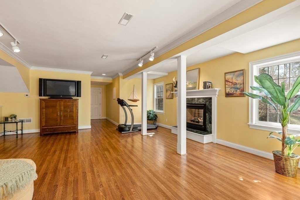 28 Cutler Farm Road Sudbury, MA 01776 - Photo 34 of 42 a living room with furniture and a flat screen tv