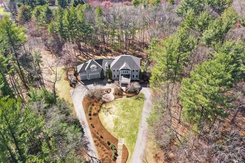 28 Cutler Farm Road Sudbury, MA 01776 - Photo 40 of 42 a view of a house with a yard and large trees