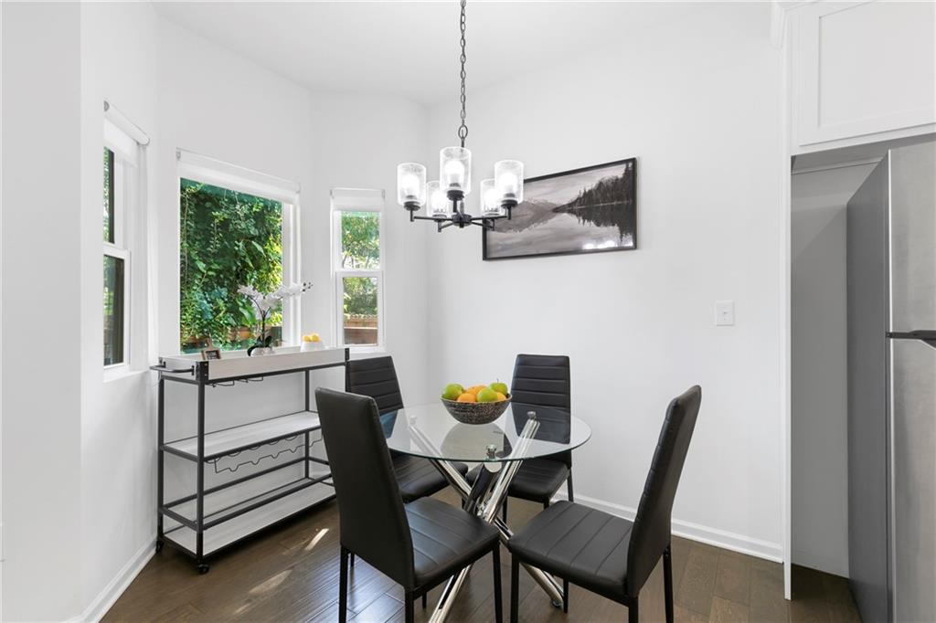 973 Mayson Turner Road Northwest Atlanta, GA 30314 - Photo 12 of 38 a view of a dining room with furniture window and outside view