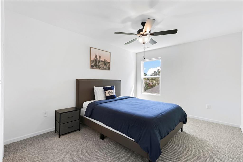 973 Mayson Turner Road Northwest Atlanta, GA 30314 - Photo 15 of 38 a bedroom with a bed and window