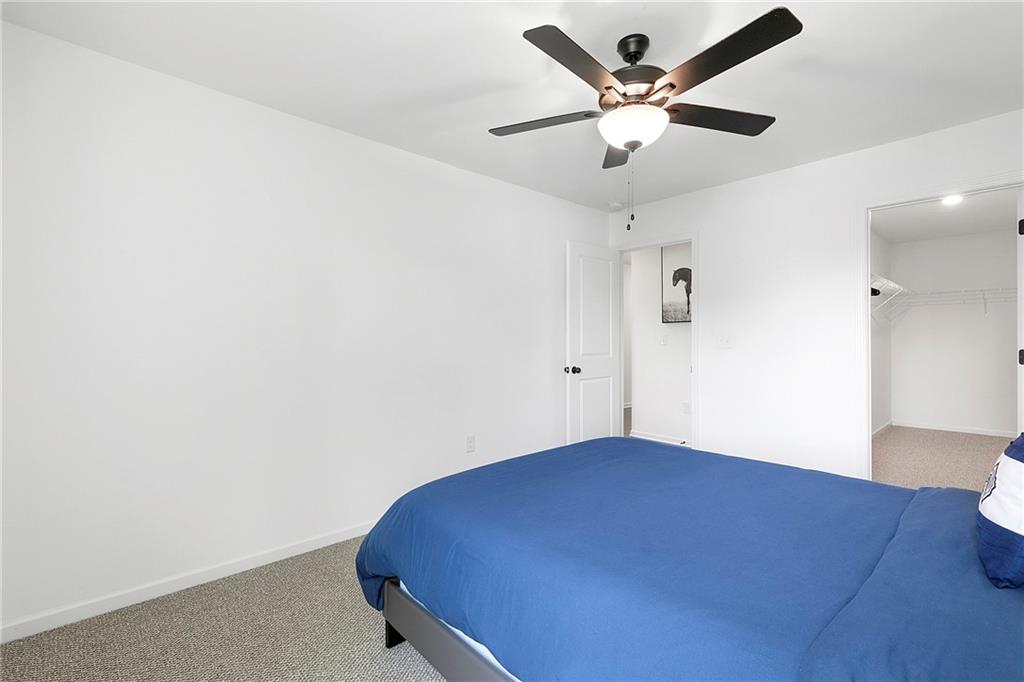 973 Mayson Turner Road Northwest Atlanta, GA 30314 - Photo 16 of 38 an empty room with a potted plant and a ceiling fan