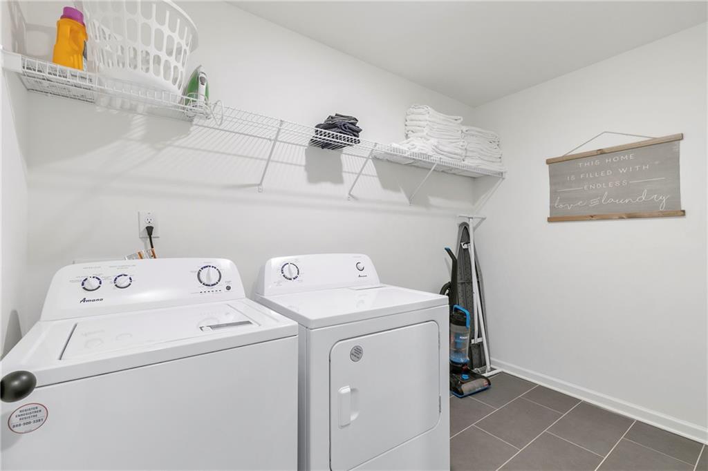 973 Mayson Turner Road Northwest Atlanta, GA 30314 - Photo 20 of 38 a view of storage and utility room with washer and dryer