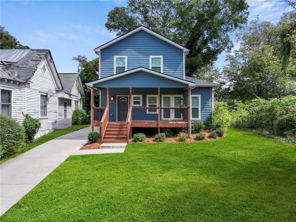 973 Mayson Turner Road Northwest Atlanta, GA 30314 - Photo 2 of 38 a view of a house with a yard