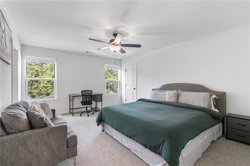 973 Mayson Turner Road Northwest Atlanta, GA 30314 - Photo 21 of 38 a bedroom with a bed couch and window