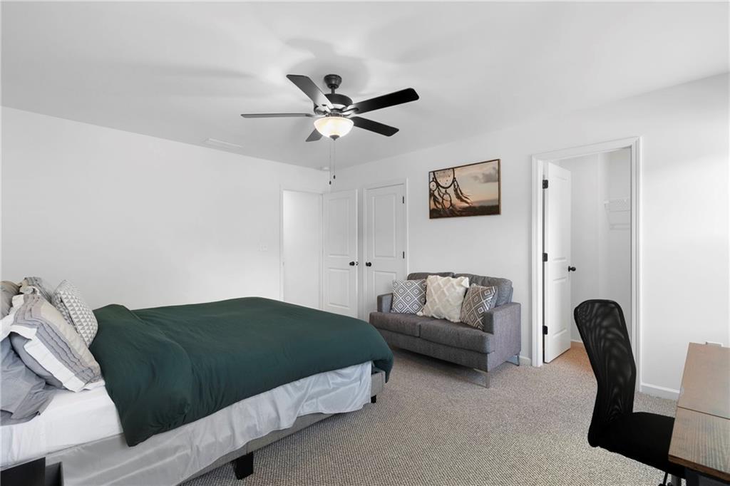 973 Mayson Turner Road Northwest Atlanta, GA 30314 - Photo 22 of 38 a living room with a couch and a couch