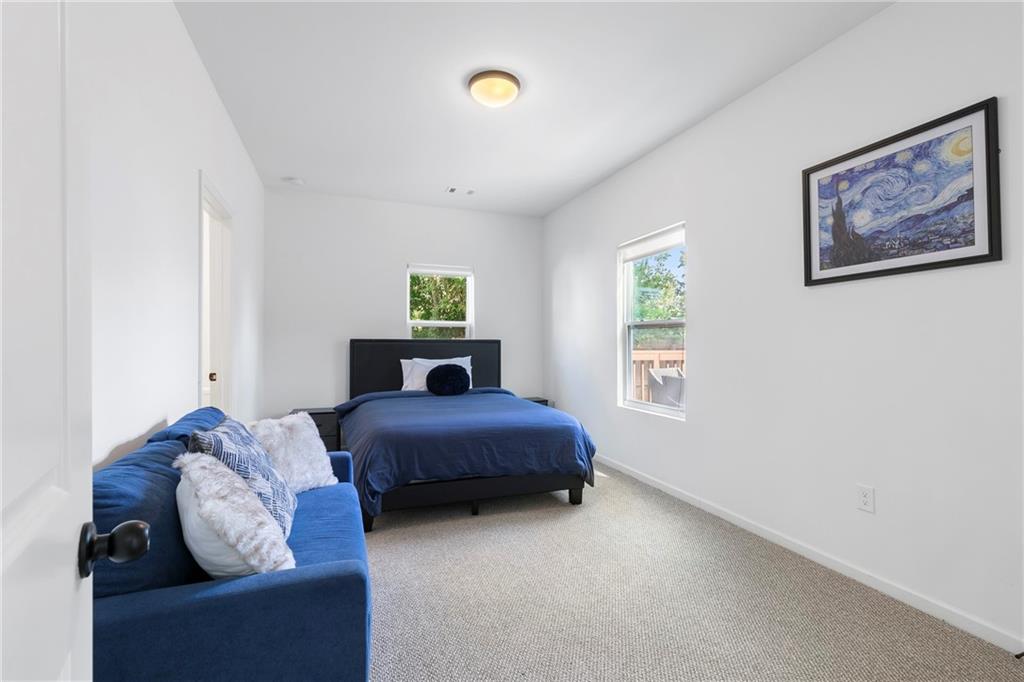 973 Mayson Turner Road Northwest Atlanta, GA 30314 - Photo 28 of 38 a bedroom with furniture and a window